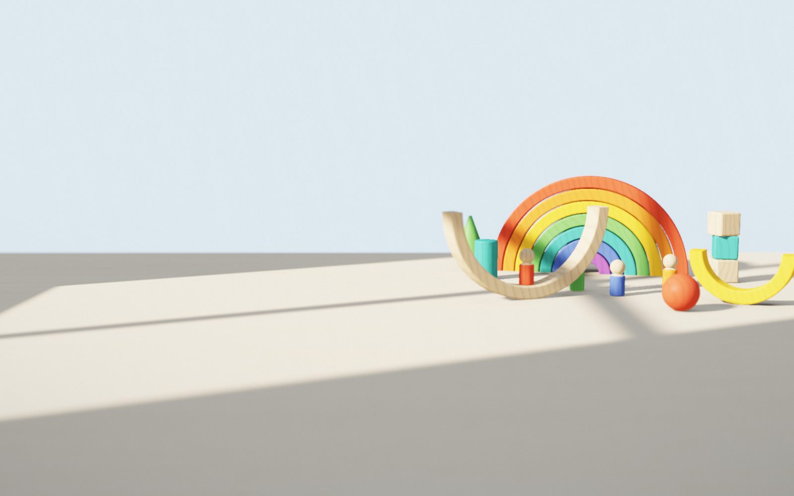 Wooden rainbow arches, peg dolls and blocks on a sunlit table