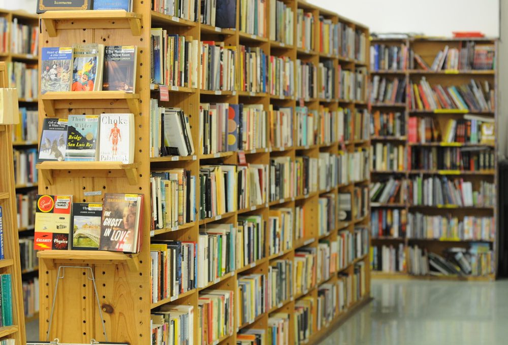 A light-wood bookshelf of children’s books